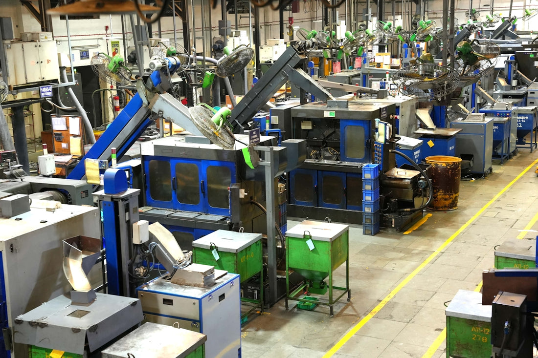 Industrial factory floor with machinery and yellow lines.