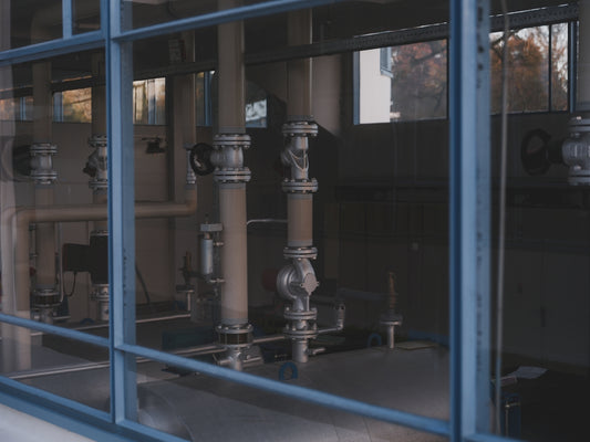 Industrial pipes and machinery inside a facility