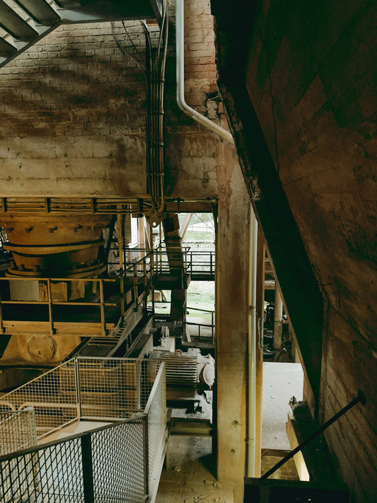 Industrial interior with metal stairs and machinery